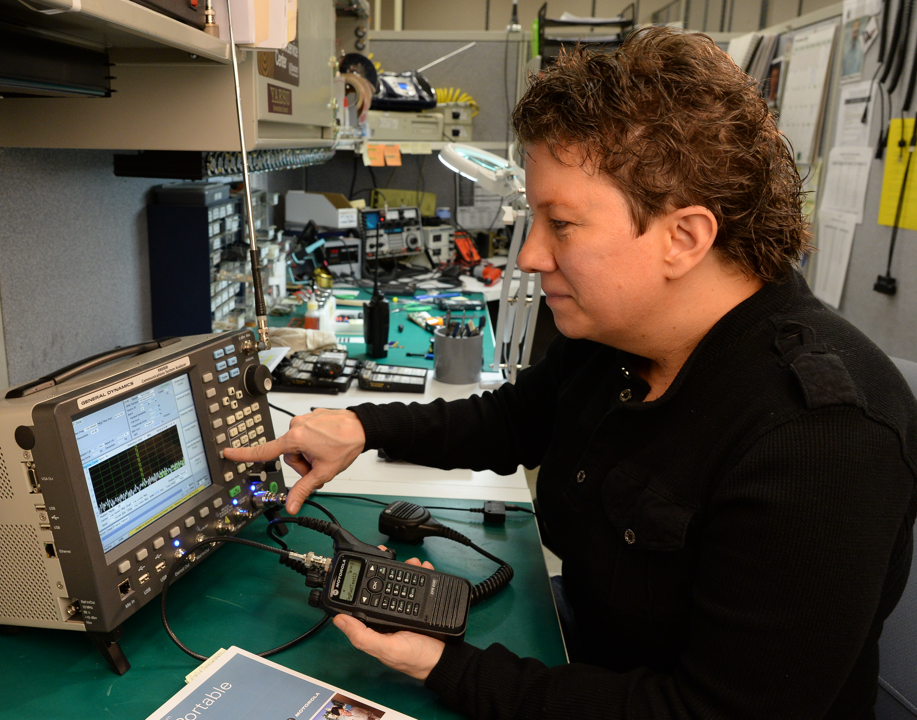 Service technician working on programming radio